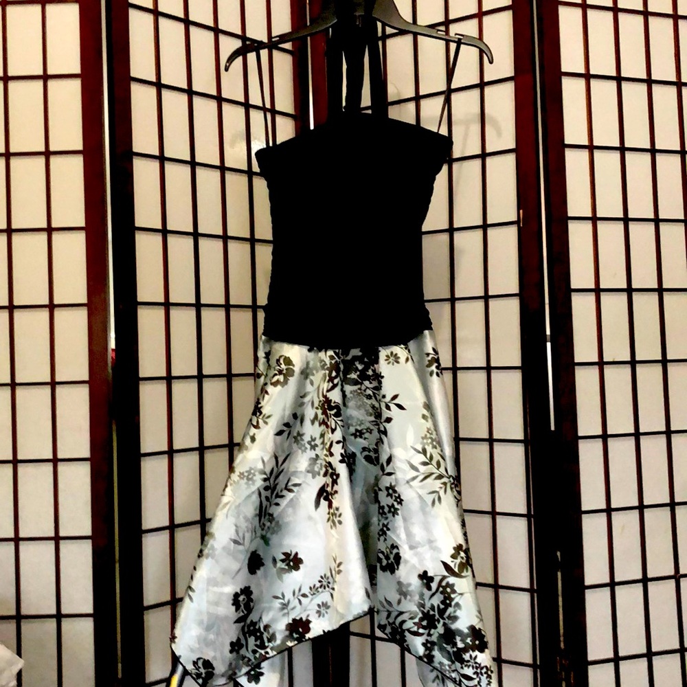 Black dress with asymmetrical floral bottom.